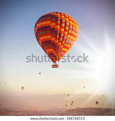Balloons in the sky over Cappadocia at sunrise. Vintage retro style