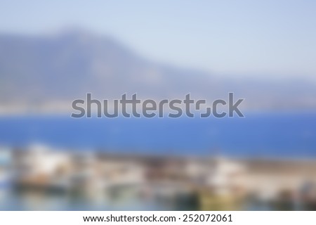 Blurred background.Boats and yachts in the bay in sunny day