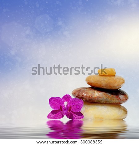 Zen spa concept background-Zen massage stones reflected in water