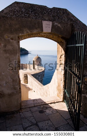 Watching spot through a gate on Dubrovnik\'s city wall. City walls served as film set of the Game of Thrones HBO TV series.