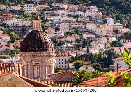 Tower of the Cathedral of assumption of the Virgin Marry with Dubrovnik in the background, Croatia. Various Dubrovnik\'s old city locations served as film sets of the Game of Thrones HBO TV series.