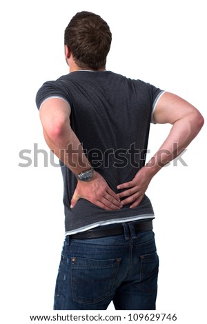 Young man holding his back in pain