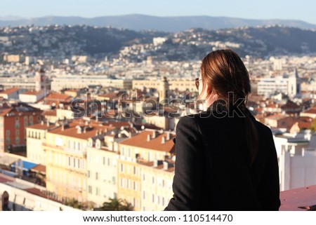 Woman looking down at the City of Nice in South of France