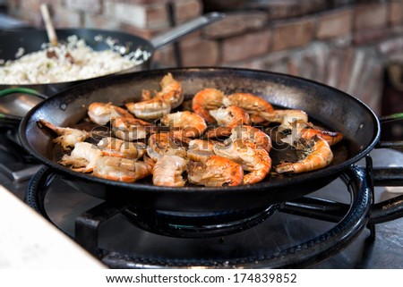 Prawns in a pan being cooked in a restaurant