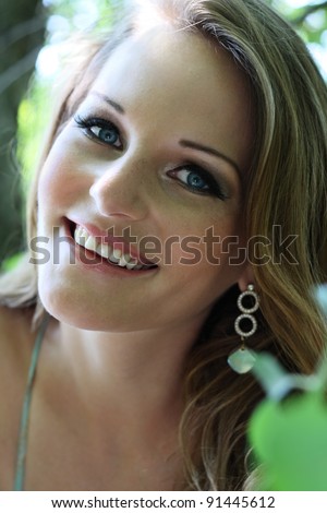 Young woman with blue eyes smiling