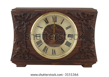Old fashioned clock showing twelve o\'clock. Clipping path included. Isolated on white background.