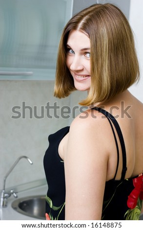 Young woman in gown on the kitchen