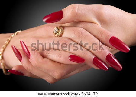 Close-up of female hands on a black background