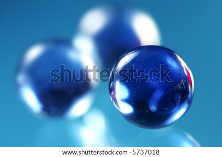Three blue glass spheres