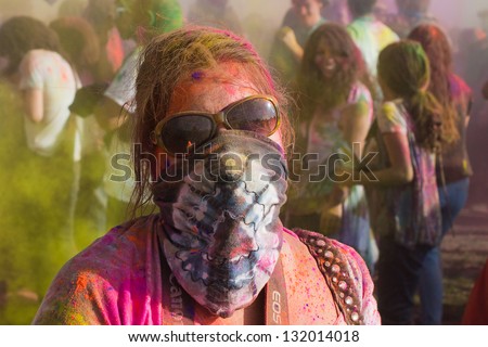 LOS ANGELES - MARCH 16 : Woman observing festivities. Holi Festival of Colors on March 16, 2013 in Los Angeles, CA