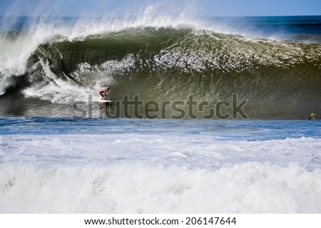 NORTH SHORE, HAWAII - January 21: Surfer catching a big wave in january 21,  2011, North Shore, Hawaii.