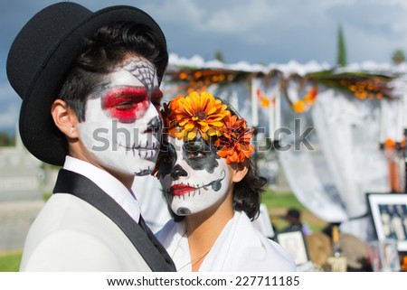 Los Angeles, CA - November 1, 2014: Unknown people and altar on display at the 15th annual Day of the Dead Festival (Dia de los Muertos) at the Hollywood Forever Cemetary in Los Angeles, CA.