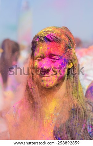 Norwalk, California, USA - March 7, 2015: Holi Festival of Colors. People dancing and celebrating during the color throw.