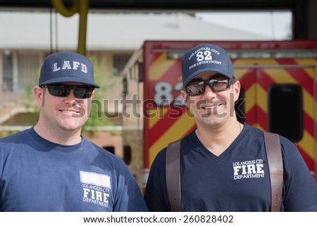Los Angeles, California, USA - March 15, 2015: Unidentified firefighters in front of the department in the 30th LA Marathon Edition