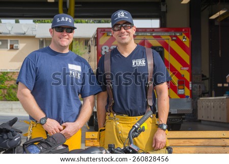 Los Angeles, California, USA - March 15, 2015: Unidentified firefighters in front of the department in the 30th LA Marathon Edition