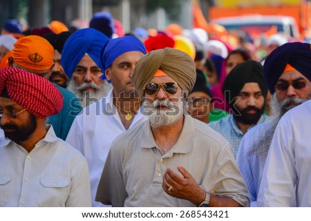 Los Angeles, CA, USA - April 5, 2015: Devotee Sikhs men with  turbans marching at the Anniversary of Baisakhi celebration.