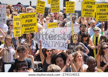 Los Angeles, CA, USA - May 02, 2015: Group of people holding signs during march against the death of Freddie Gray, a man of Baltimore who was seriously injured in police custody.