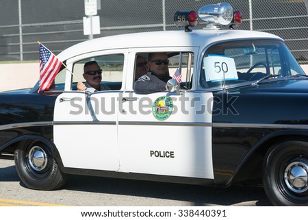 Mission Hills, USA - November 11, 2015: Vintage police car during The San Fernando Valley Veterans Day Parade