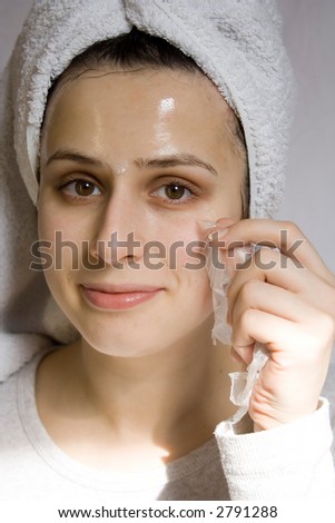 Portrait of young woman with beauty mask