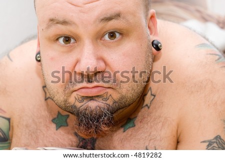 portrait of a man with tattoos and beard