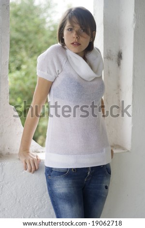 beautiful girl wearing white polo-necked sweater