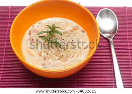 fresh lentil soup in an orange bowl