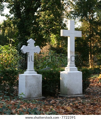 Old German graveyard with two white crosses