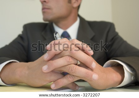 Business man crossing fingers