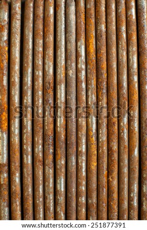 closeup of rusty nails next to each other in strait line