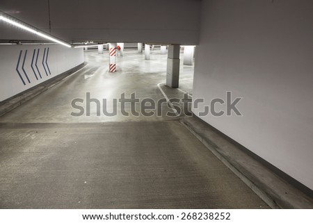 empty driveway in deserted concrete parking garage