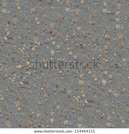 Seamless Tileable Texture of Old Asphalt Road with a Small Number of Protruding Stones.