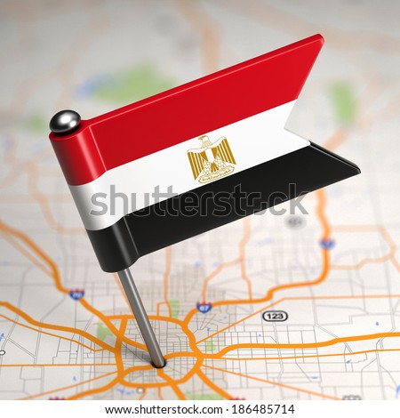 Small Flag of Egypt Sticked in the Map Background with Selective Focus.