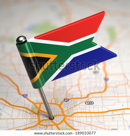 Small Flag of South Africa on a Map Background with Selective Focus.