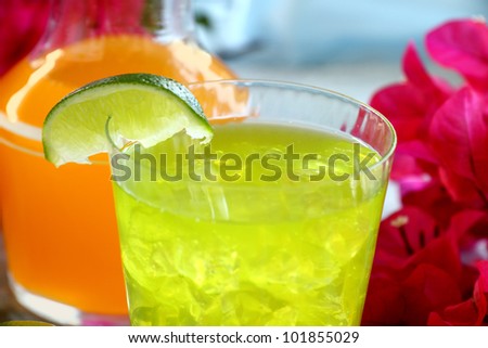 Chilled iced lime drink with a slice of fresh lime.