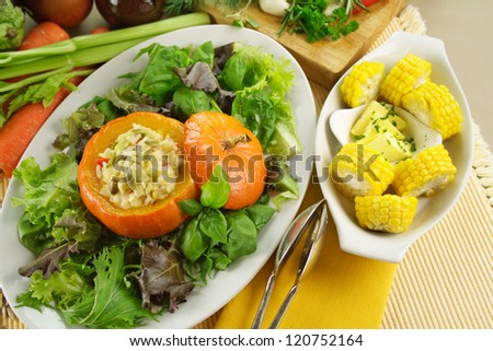 Fresh vegetables with baked golden nugget pumpkin with rice stuffing and corn.