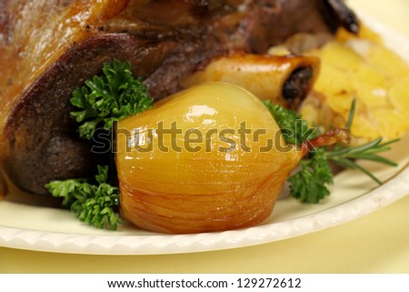 Delicious baked onion served with a leg of lamb.