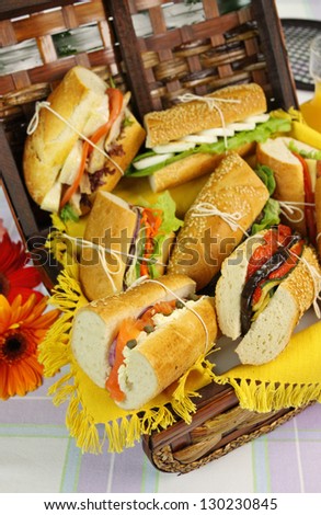 Selection of food and salad rolls in a picnic hamper ready to go.