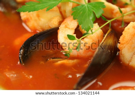 Delicious Mediterranean style tomato seafood soup with mussels and mixed seafood.