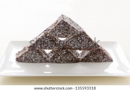 The iconic Australian cake the lamington made into a stack with chocolate and coconut.