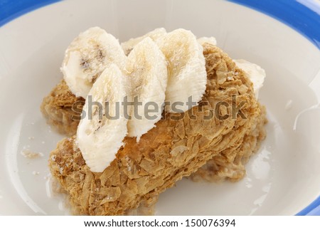 Iconic Australian breakfast cereal Weet Bix served with sliced banana.