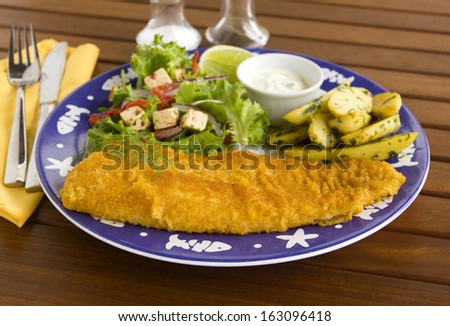 Delicious fried crumbed fish with kipfler potatoes and a fresh garden salad.