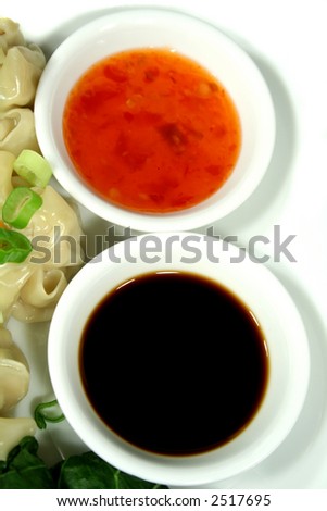 Soy sauce and sweet chilli dipping sauces.