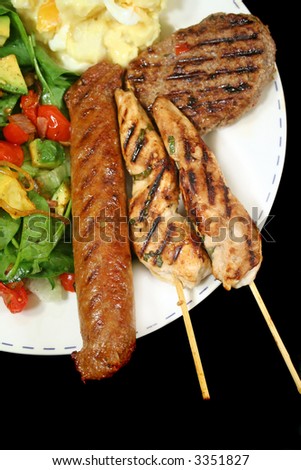 BBQ chicken tenderloin skewers, beef sausage, beef patty with spinach salad and potato salad.