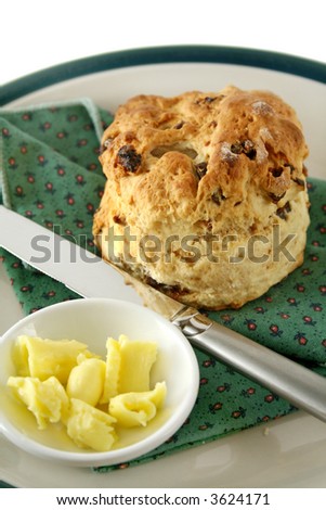 Fresh baked date scone with butter curls.
