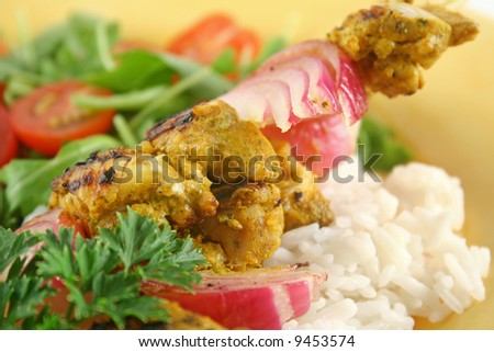 Chicken tandoori skewers with minted yogurt and a rocket salad.