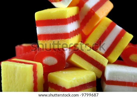 Colorful striped fruit flavored candies ready to eat.