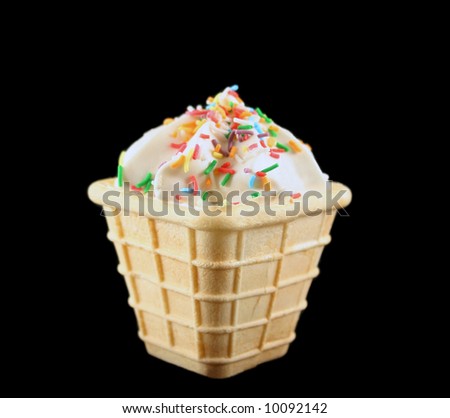 Sweet marshmallow cone with colored cake sprinkles.
