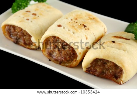 Delicious fresh baked homestyle sausage rolls ready to serve.