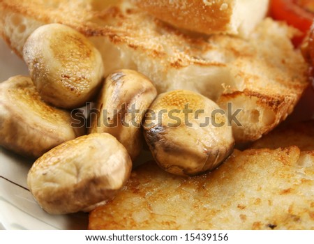 Button mushrooms with toast and a hash brown.