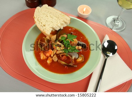 Delicious Mediterranean style tomato seafood soup with a variety of mixed seafood.